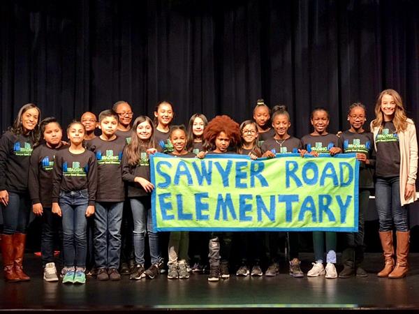 Sawyer Road Elementary Reading Bowl team group photo with banner